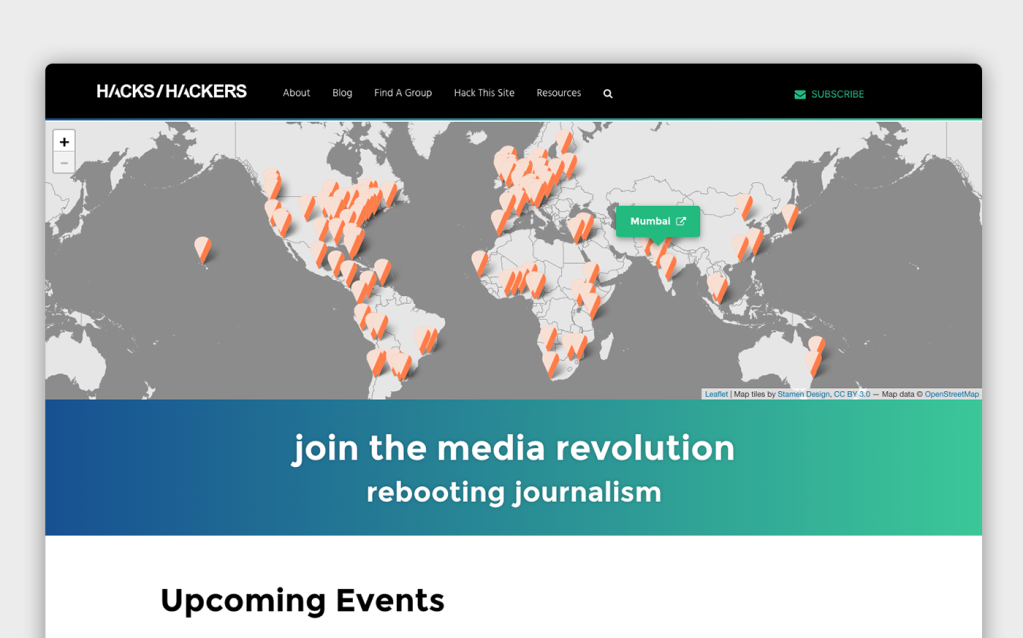 The front page of Hacks/Hackers with navigation, a map of the world with many orange pins in it, and the tagline "join the media revolution - rebooting journalism" followed by the header "Upcoming Events" above the fold